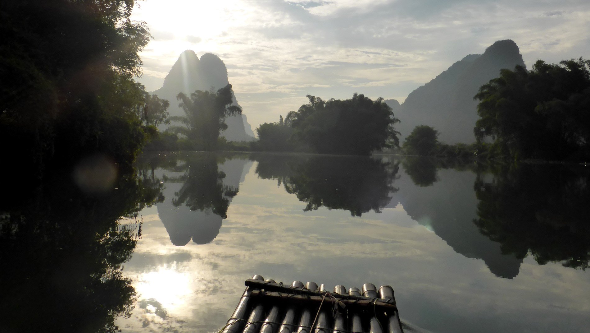 Li River~Feel your cares drift away with the current as you are punted along the river though the stunning karst landscape. Children run to school along the river bank, villagers collect clumps of reeds to weave into mats, farmers hide from the sun under thatched shelters on their adjacent fields.