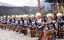 Miao girls begin a folk dance