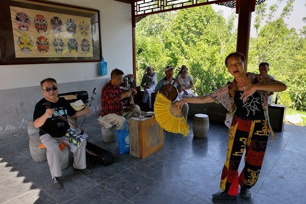 Locals practicing opera in the park 